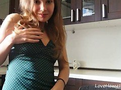 Beauty in a green skirt teases with curves