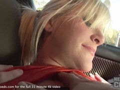 Sexy blonde masturbating in a parked car while being filmed by a daring camera girl