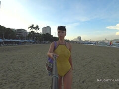 MILF exhibitionist in fishnet swimsuit outdoors on public beach