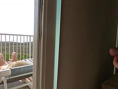 Silvercouple69s Bikini Cougar Teases Passersby on Balcony