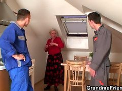 Nasty granny spreads her legs for two cocks