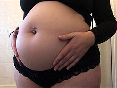 Bloated babe's massive water belly inflation for stomach enthusiasts