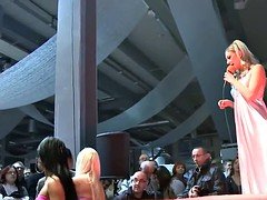 Slutty stripper sitting on a massive dildo
