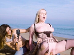 Georgie Lyall and Frida Sante pleasuring horny stud on the beach