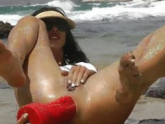 Sparkling fun at the beach with large red dragon sextoy anal