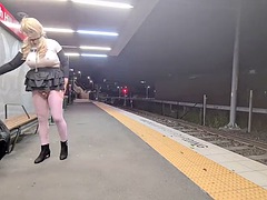 Gagged and riding a huge dildo at the train station repeat