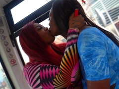 Ebony lesbos play with strapon in public