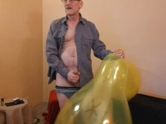 Naughty older man masturbates while enjoying a kinky balloon play