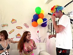 Tattooed brunettes Misha Montana and Rebecca Vanguard deepthroat and blow a fresh clown dick