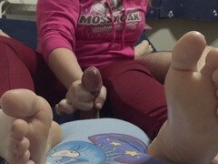 Footjob with soles on belly while wearing a hood
