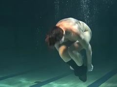 Dressed underwater beauty Bulava Lozhkova swims naked