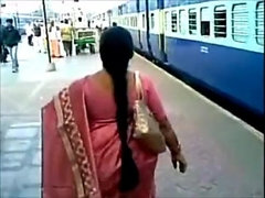 Girl with a highly lengthy hair is posing in front of the camera sans clothes