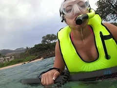Adriana sees a turtle while snorkeling