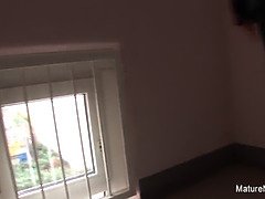 Brunette granny blows the cameraman while her friend watches