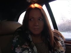 Brunette rides a hard cock then strokes it for a cumshot in the backseat