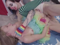 A sexy thin woman is with a clown, getting her wet pussy penetrated