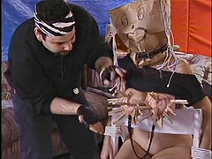 Chubby whore with a paper bag on her head gets her jugs and pussy licked