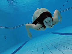 Beauty Katie in a red swimsuit with a thick pussy underwater