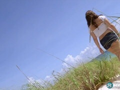 Jennica Lynn's hot solo beach adventure: busty babe with huge tits and ass bouncing on the beach