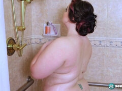 Lucy Lenore's bushy pussy trimmed by her big tits and ass in steamy solo session