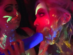 Black-light kittens Nadia and Ophelia give head off a colorful cum cannon