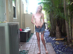 Teen Kate Bloom fucks her pussy on the sidewalk