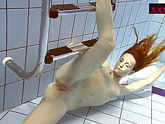 jaw-dropping scorching woman swimming in the pool