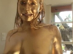MILFs with voluptuous breasts covered in gold paint for a shiny and erotic golden MILF show