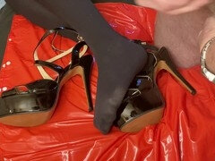 Seductive foot tease in high heels and stilettos, satisfying shoe fetish desires