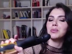 Horny brunette Valentina Nappi is playing with a curved dildo