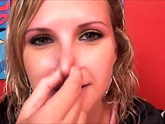 blond girl plays with her nose