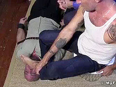 Mature smooth-shaven fellow bound and tortured with feet on his face