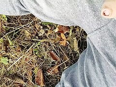 Bear outdoors in the woods gets his dick out and cums