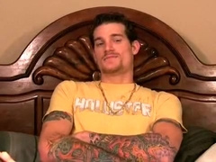 Heavily tattooed guy tops ass