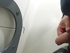 pissing in a public toilet on train