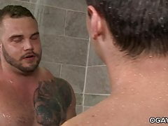 Muscular guys fuck in the shower