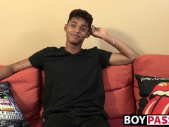 Black young man gives an interview and stimulates himself