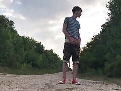 Teenager jerking off on a dusty road
