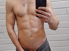 Handsome athletic man jerks off and makes selfie