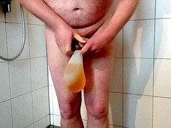 Horny pissing in rubber socks