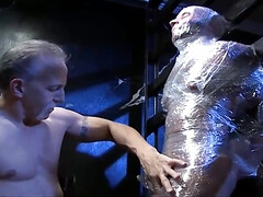 His entire body is covered and his cock gets toyed with