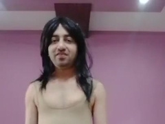 Crossdresser femboy in bare form wear with a rod outside of it.