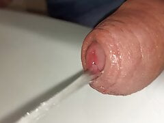 close up uncutted pissing cock