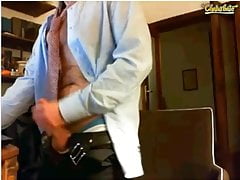 Businessman showing his black otc socks in the office
