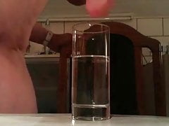 Underwater cumshot in glass of water