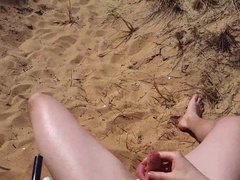 Bald twunk edging on a public beach