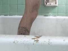 Frolicking with pink cigar in sloppy hostel bathroom