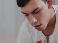 Ryan lies down on the massage table for a full body rubdown