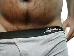 A horny Black Asian guy exercise with a stone to get a big dick