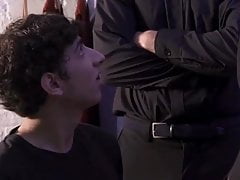Two priests play with young boy